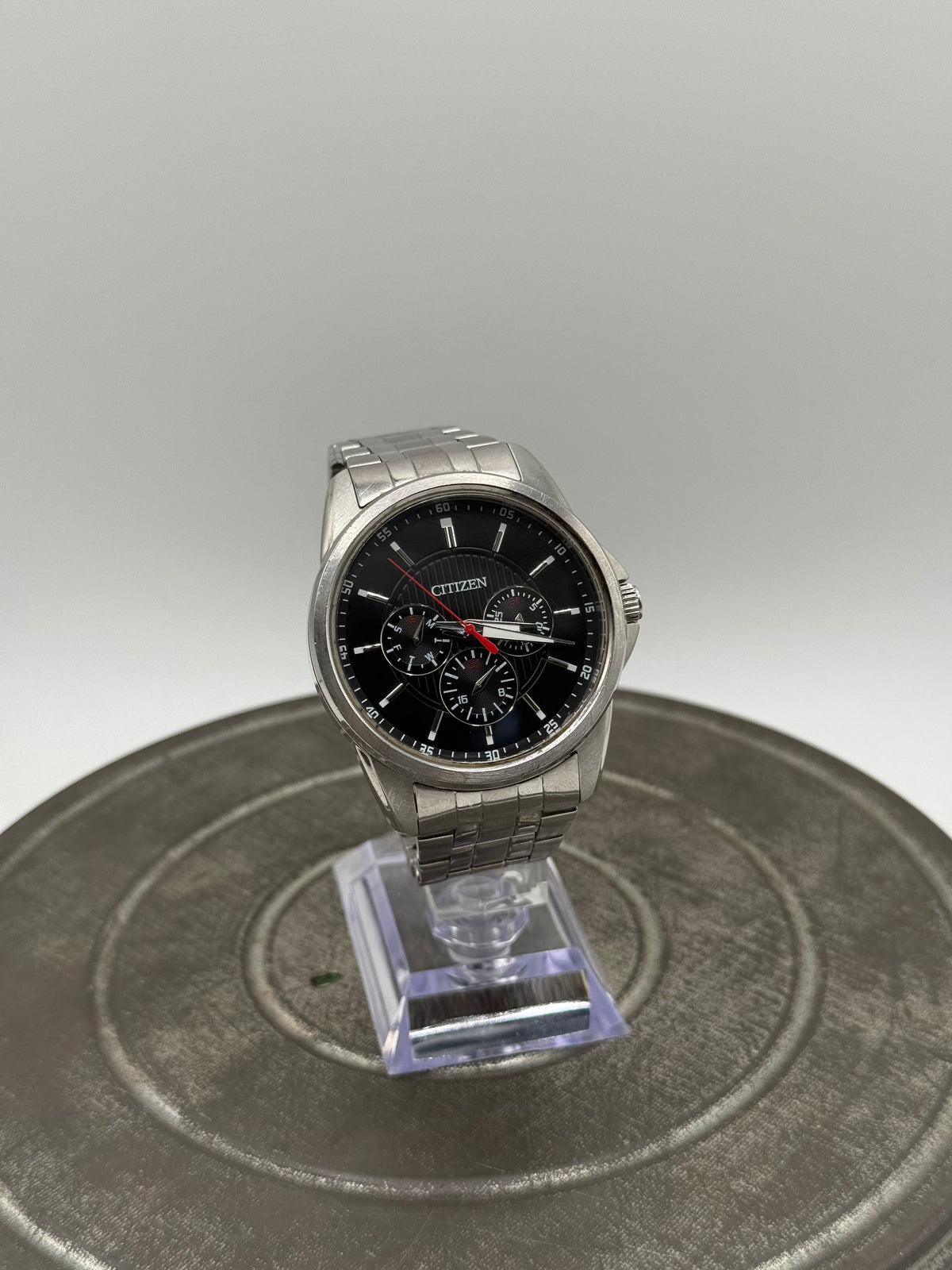 Citizen Multifunction Watch – Black Dial, Red Accents, Stainless Steel Bracelet, Three Subdials