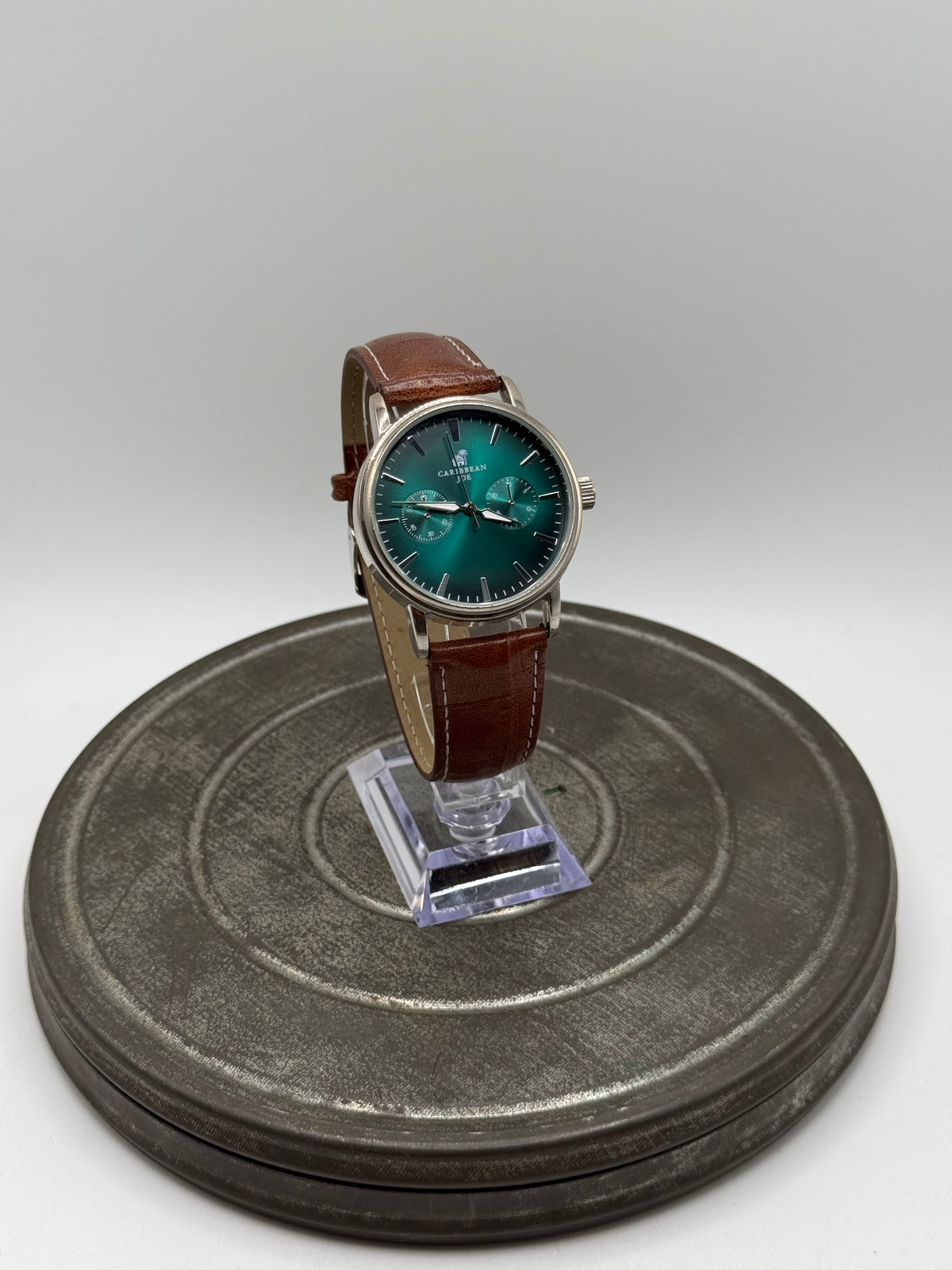 Green dial brown strap watch