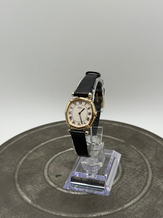 Vintage Seiko Quartz Ladies Dress Watch – Gold Tone octagonal Case, White Roman Numeral Dial, Black Strap