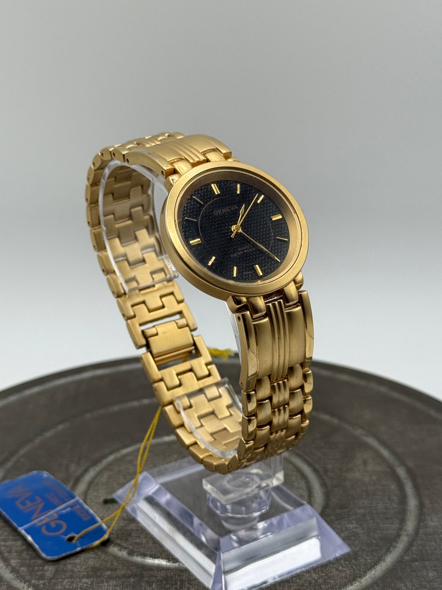 Vintage Geneva gold tone black dial watch