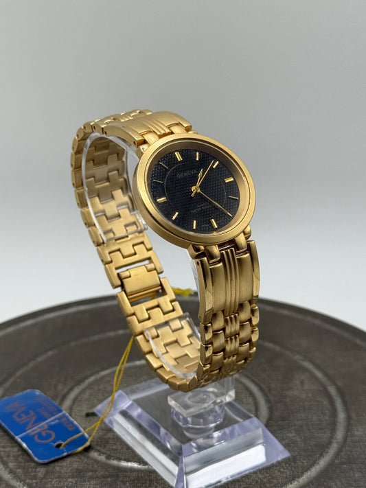Vintage Geneva gold tone black dial watch