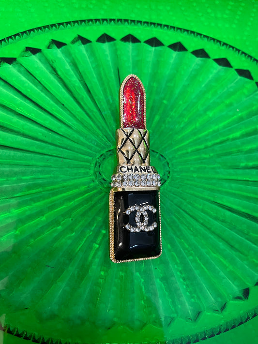 Chanel lipstick broach